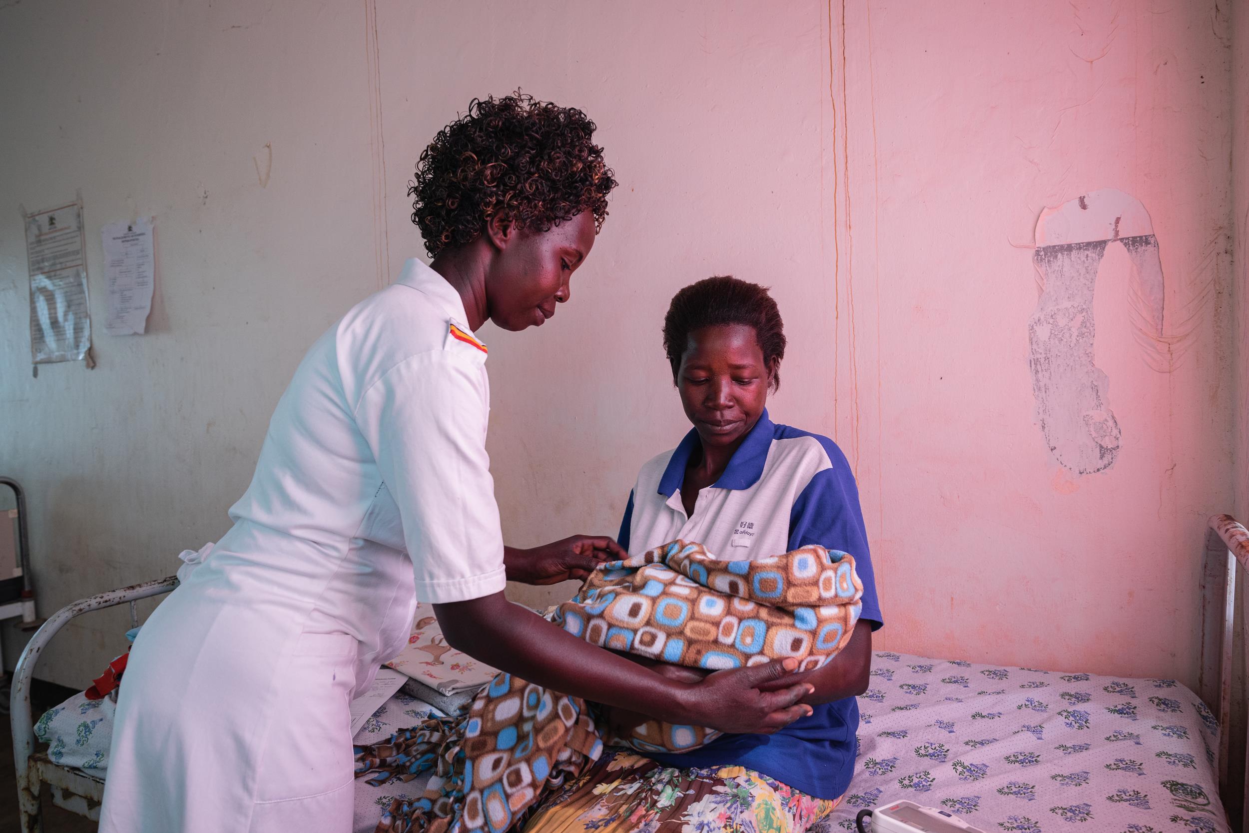 A midwife in Ugand, Africa checks on a mother and her newborn. 